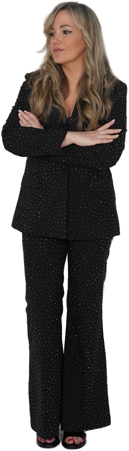 Silvia Mogas standing with arms crossed, black suit